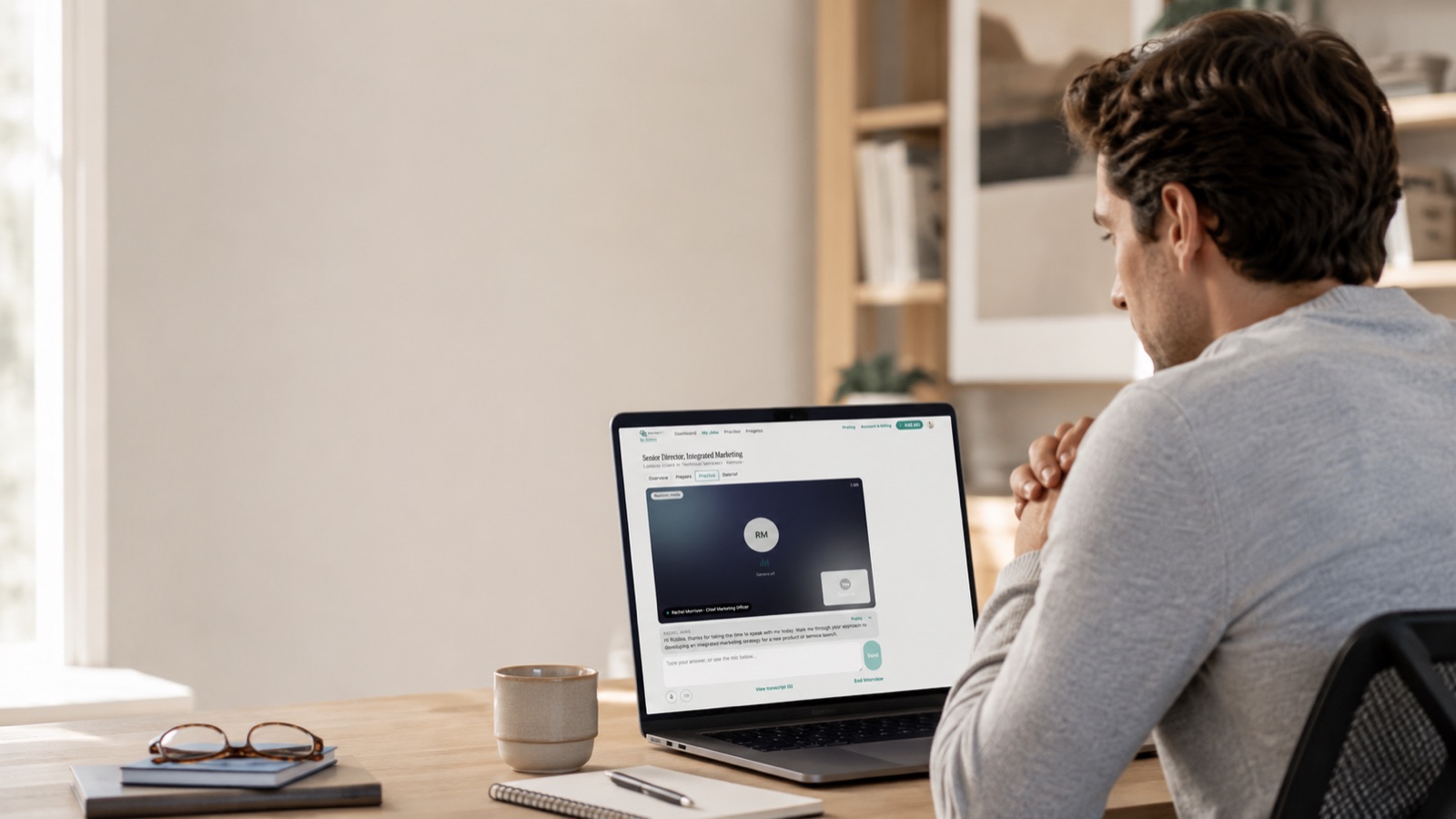 A candidate practicing a mock interview with InterviewIQ AI on his laptop